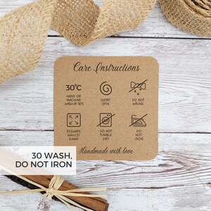 May include: Care instructions for a handmade item. The instructions include washing at 30 degrees Celsius, short spin, do not wring, reshape while damp, do not tumble dry, and do not iron. The text "30 WASH, DO NOT IRON" is also included.