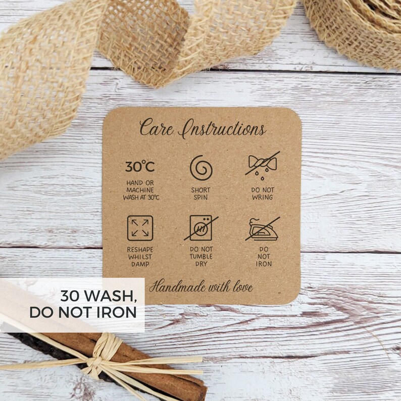 May include: Care instructions for a handmade item. The instructions include washing at 30 degrees Celsius, short spin, do not wring, reshape while damp, do not tumble dry, and do not iron. The text "30 WASH, DO NOT IRON" is also included.