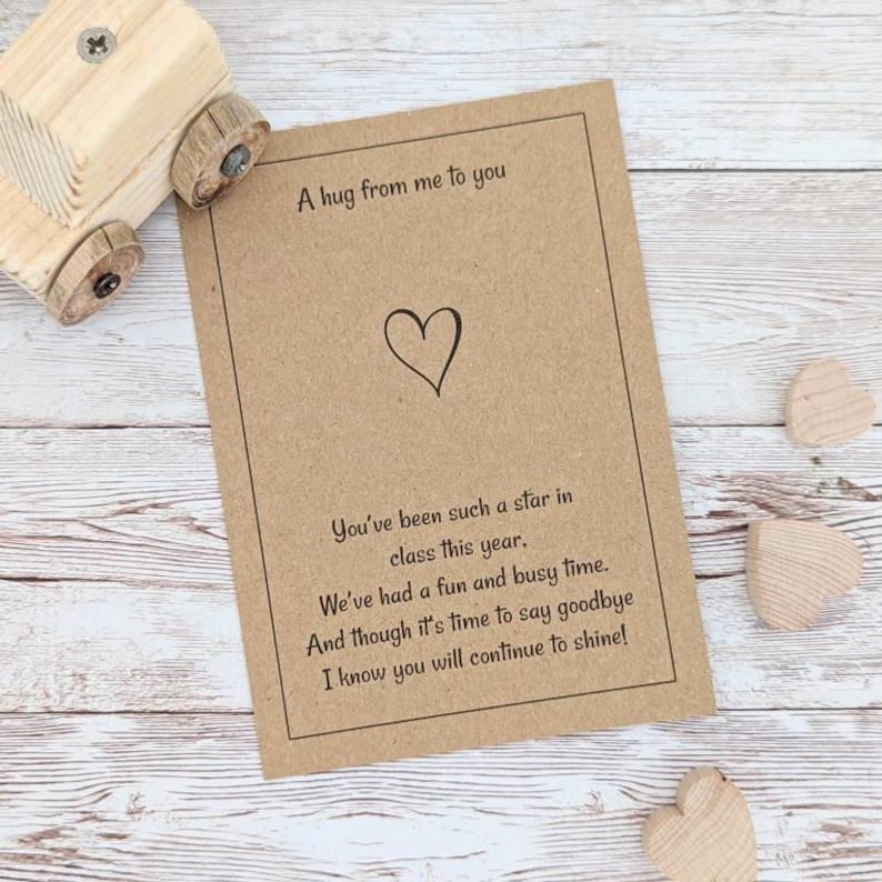 May include: A brown card with a heart and the text "A hug from me to you" and "You've been such a star in class this year. We've had a fun and busy time. And though it's time to say goodbye I know you will continue to shine!"