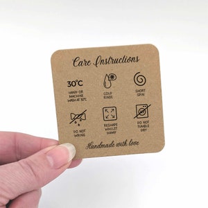May include: Care instructions for a garment. The instructions include washing at 30 degrees Celsius, cold rinse, short spin, do not wring, reshape whilst damp, and do not tumble dry. The text "Handmade with love" is at the bottom of the card.