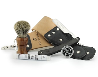 Kit de afeitado con navaja de afeitar negra hecha a mano, correa de cuero y pasta de afilar.