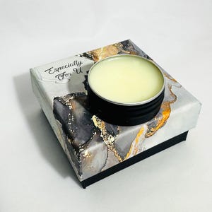 15g Medicinal Green solid perfume packaged in a marble-print gift box next to the open tin. A unique niche fragrance gift.