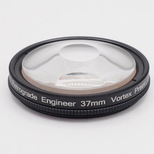 May include: A black 37mm Vortex Prism Retrograde Engineer lens filter.
