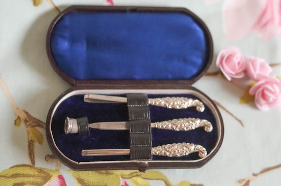 Sterling silver-handled boxed Edwardian part manicure set and sterling silver thimble