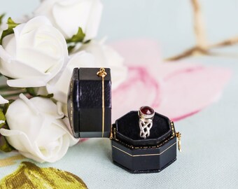 New garnet and sterling silver Celtic ring in antique-style leather ring box