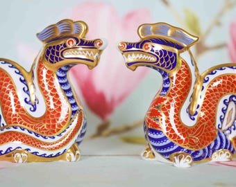 Two Royal Crown Derby dragons : 22 carat gold, fine porcelain paperweights