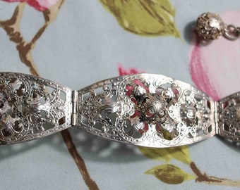 Highly ornate seven panel adjustable vintage dress belt