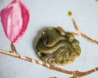 Old Jadite pendant - coiled dragon or sea serpent