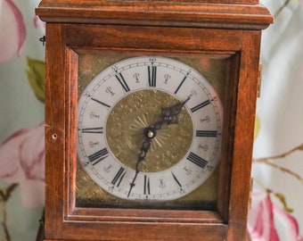 German oak-cased mantle clock with silver chapter ring: 14 inches height
