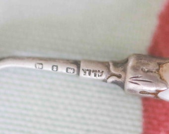 Victorian mother of pearl and sterling silver button hook:  1892