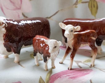 much sought after Beswick Hereford bull, cow and calves: all fine condition