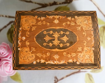 pretty Swiss music box with an internal car emblem, perhaps for a car enthusiast:  good working order