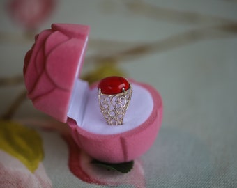 Sterling silver filagree ring with coral toned stone size 0: supplied in rosebud box