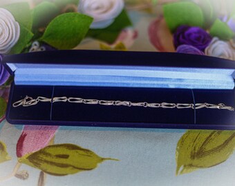 Pretty vintage silver braided bracelet supplied in new box