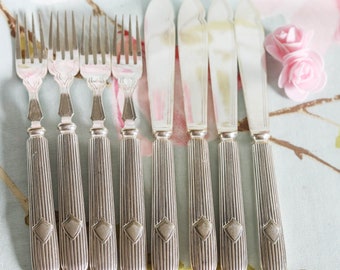 Set of four Edwardian fish knives and forks: heavy with vacant name plate (shield)