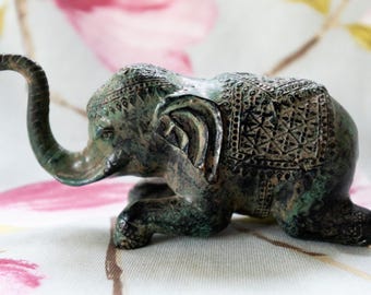 19th century patinated bronze of a recumbent elephant: Asian