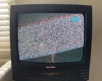 Televisor CRT Sharp vintage con videograbadora incorporada / Televisor para videojuegos retro / Estética de los 90 / En funcionamiento