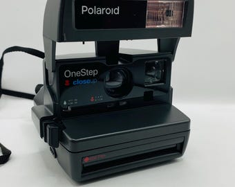 Cámara Polaroid / Un paso más cerca / Cámara vintage