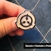 The Batacombes reviewed SCP Foundation logo pin badge - Secure. Contain. Protect.