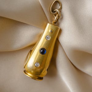 Vintage Pendant 14k Cigarello Cutter with Sapphire Cabachon and Two Old Mine Cut Diamonds** Antique Glamour**