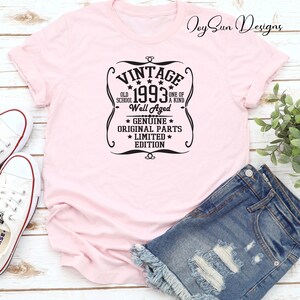 May include: Pink t-shirt with a black vintage style graphic that says "Vintage 1993 Old School Well Aged One of a Kind * Genuine * Original Parts * Limited * Edition"