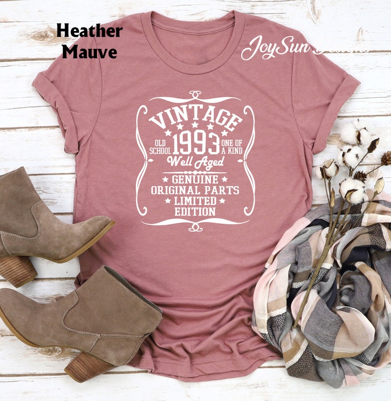 May include: Heather mauve t-shirt with a white vintage design that says "Vintage 1993 Old School One of a Kind Well Aged Genuine Original Parts Limited Edition".