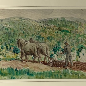 May include: A watercolor painting depicting a rural scene with two horses pulling a plow. The horses are brown and white, and the plow is brown. A man in a dark blue shirt and pants is walking behind the horses, guiding the plow. The background is a green and brown landscape with hills and trees.
