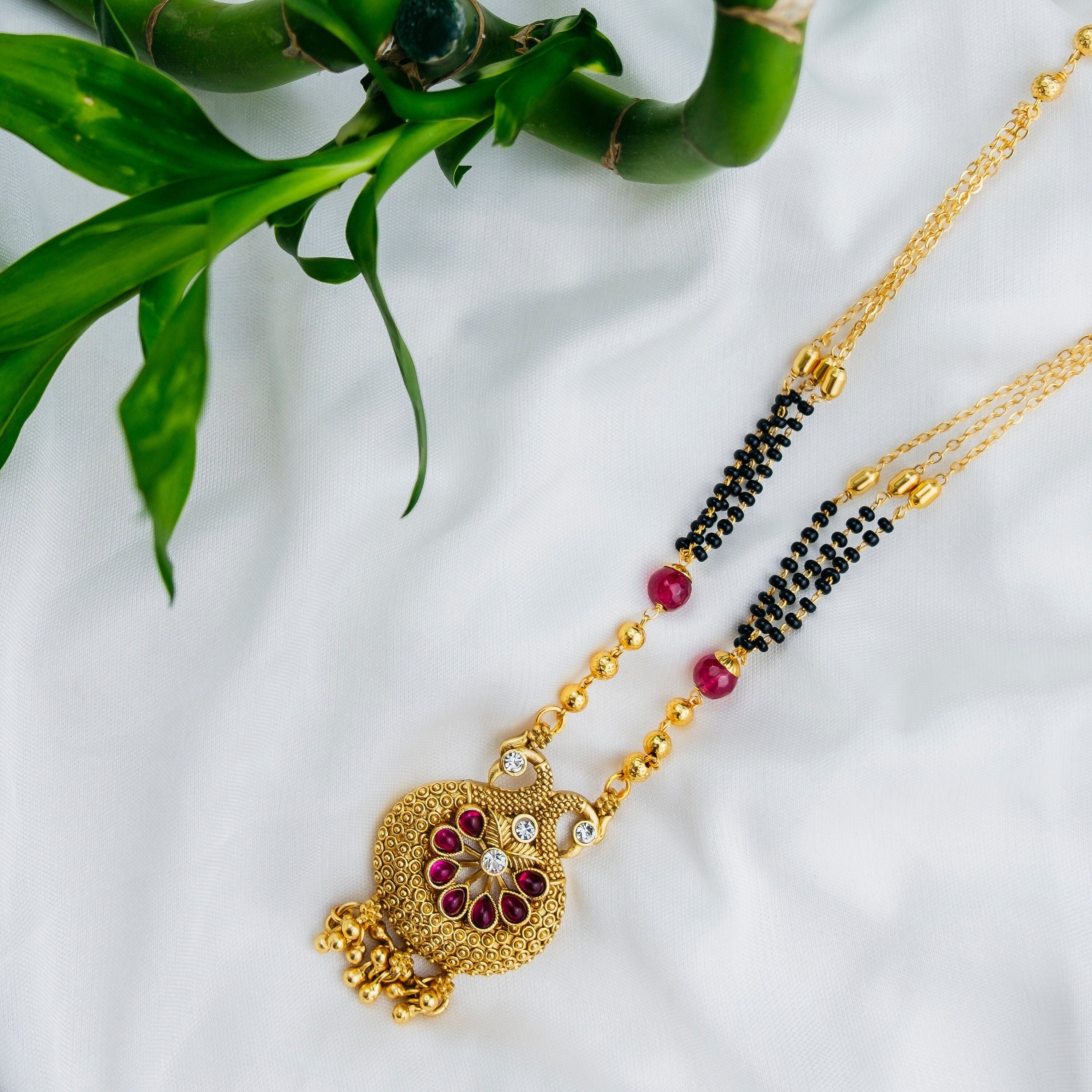 Short black beads mangalsutra designs sale