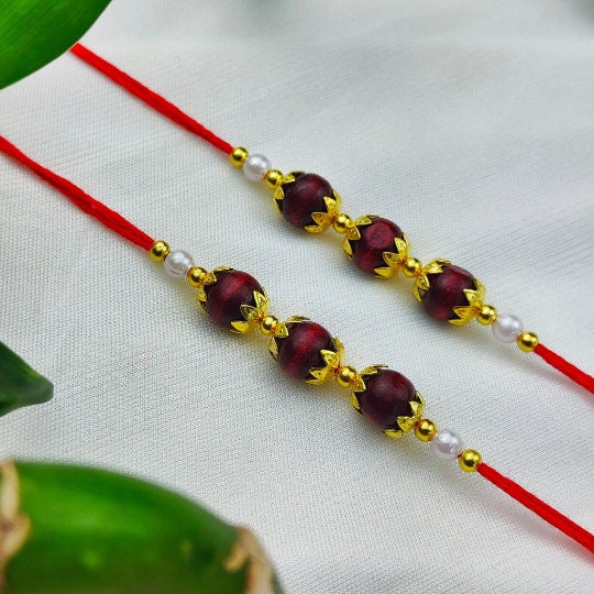 Designer Golden OM Rakhi with Sandalwood Beads