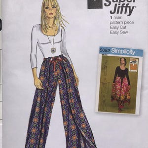 May include: Simplicity sewing pattern S9595 showing a fashion illustration of wide-leg trousers with a floral design. The pattern includes the text "Super Jiffy" and "Easy Cut, Easy Sew."