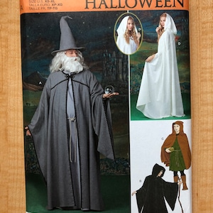 May include: A sewing pattern for Halloween costumes, featuring four different designs: a wizard, a hooded cloak, a hooded cloak with a hood, and a hooded cloak with a hood and a belt. The pattern is titled "Simplicity Halloween" and includes the number "R11579".