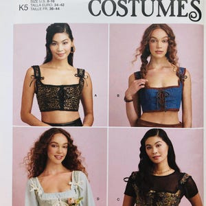 May include: Simplicity Costumes pattern S9943 featuring four different costume tops. The pattern includes sizes U.S. 8-16. The tops include a leopard print, denim, light blue, and floral design. The pattern is for costumes.