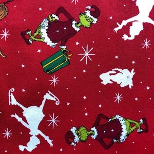 Robert Kaufman Grinch on Red Lightweight Woven Cotton Grinch Christmas Holiday Fabric How the Grinch Stole Christmas