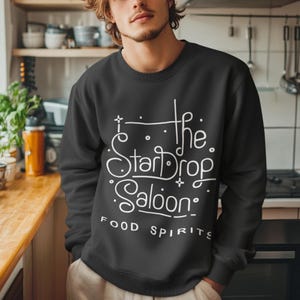 Stardew Valley Sweatshirt, Stardew Sweatshirt, Stardrop Saloon Shirt, Stardew Valley Gift Unisex Heavy Blend Crewneck Sweatshirt