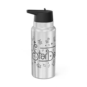 May include: A silver stainless steel water bottle with a black lid and a black and white design featuring the word "Stardew" and various small illustrations of flowers, leaves, and animals.