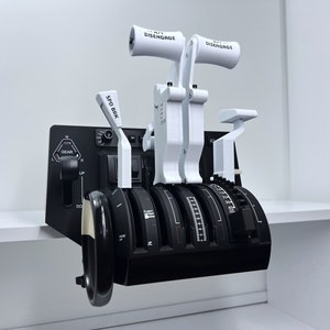 May include: A black and white flight simulator control panel with four throttle levers, two white levers labeled "DISENGAGE", and a white lever labeled "SPD BRK".