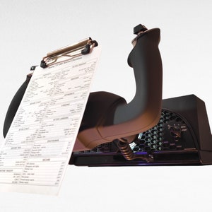 May include: A black flight simulator joystick with a checklist attached to the top. The checklist is titled "Boeing 737  Normal Checklists".