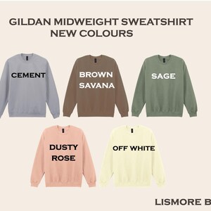 a collection of five different colored GILDA MIDWEIGHT SWEATSHIRTS, each with a unique color and design.