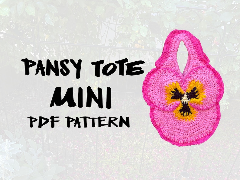 May include: A pink crocheted tote bag shaped like a pansy flower. The bag has a yellow and black centre and a handle. The text "PANSY TOTE MINI PDF PATTERN" is written in black on a white background.