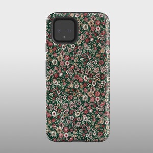 May include: A green phone case with a floral pattern featuring pink, white, and orange flowers. The case has a cutout for the camera lens.