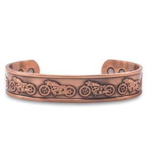 May include: A copper bracelet featuring a repeating design of motorcycles. The bracelet has a magnetic clasp.