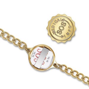 May include: A gold chain bracelet with a round, gold medical alert tag that says "SOS" and "MEDICAL INFO". The tag has a clear window to insert medical information.