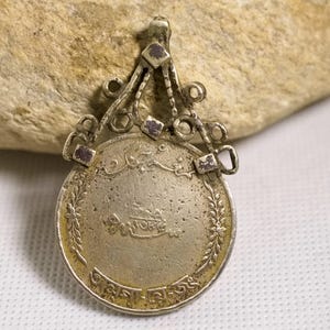 antique silver alloy coin pendant