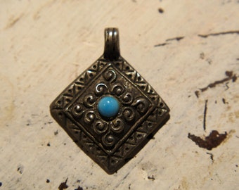 metal and turquoise pendant