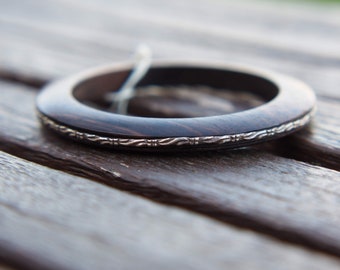rigid bracelet in ebony and silver cod.BRACC24