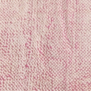 May include: Close-up of a pink and white textured fabric with a soft, fuzzy surface.