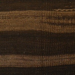 May include: Close-up of a woven fabric with horizontal stripes in shades of brown.
