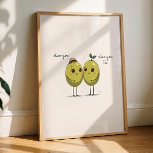 May include: A framed wall art print featuring two cartoon green olives with faces, arms, and legs. One olive wears a small brown hat. The text "olive you" is printed on the left and "olive you too" is printed on the right in black script.