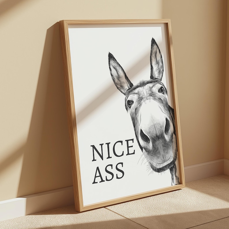 White and grey bathroom wall art print featuring a donkeys face with the humourous quote Nice Ass.