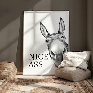 White and grey bathroom wall art print featuring a donkeys face with the humourous quote Nice Ass.